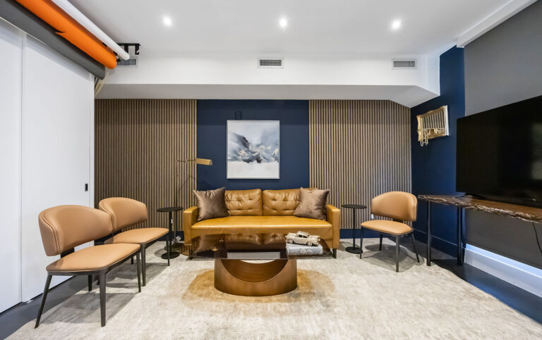 The Atlas podcast studio in Toronto: navy and gold cinematic lounge